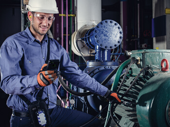 Technician performing Testing/Adjusting/Balance services