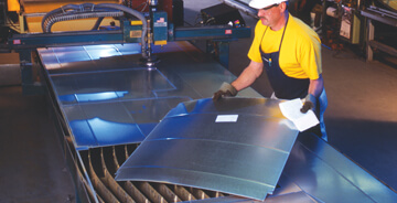Gowan team member working on a custom sheet metal project
